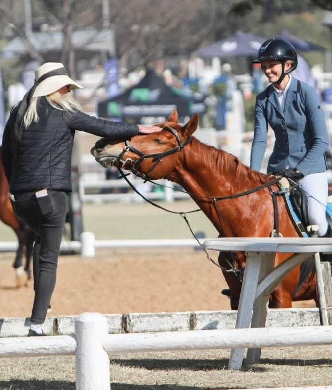 lady petting horse